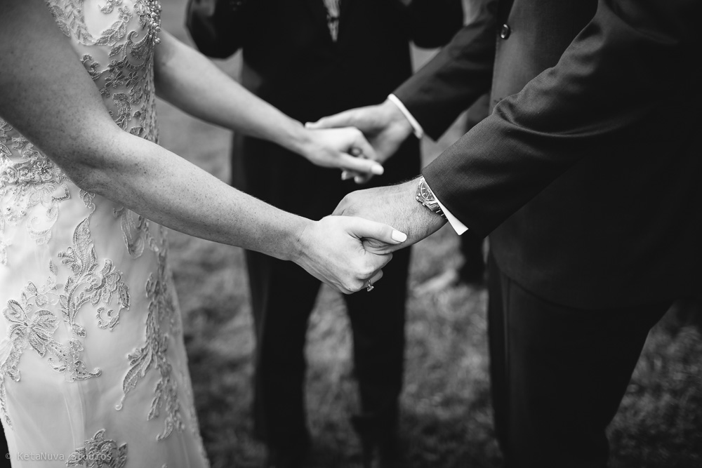 Perona Farms wedding - bride and groom holding hands. 