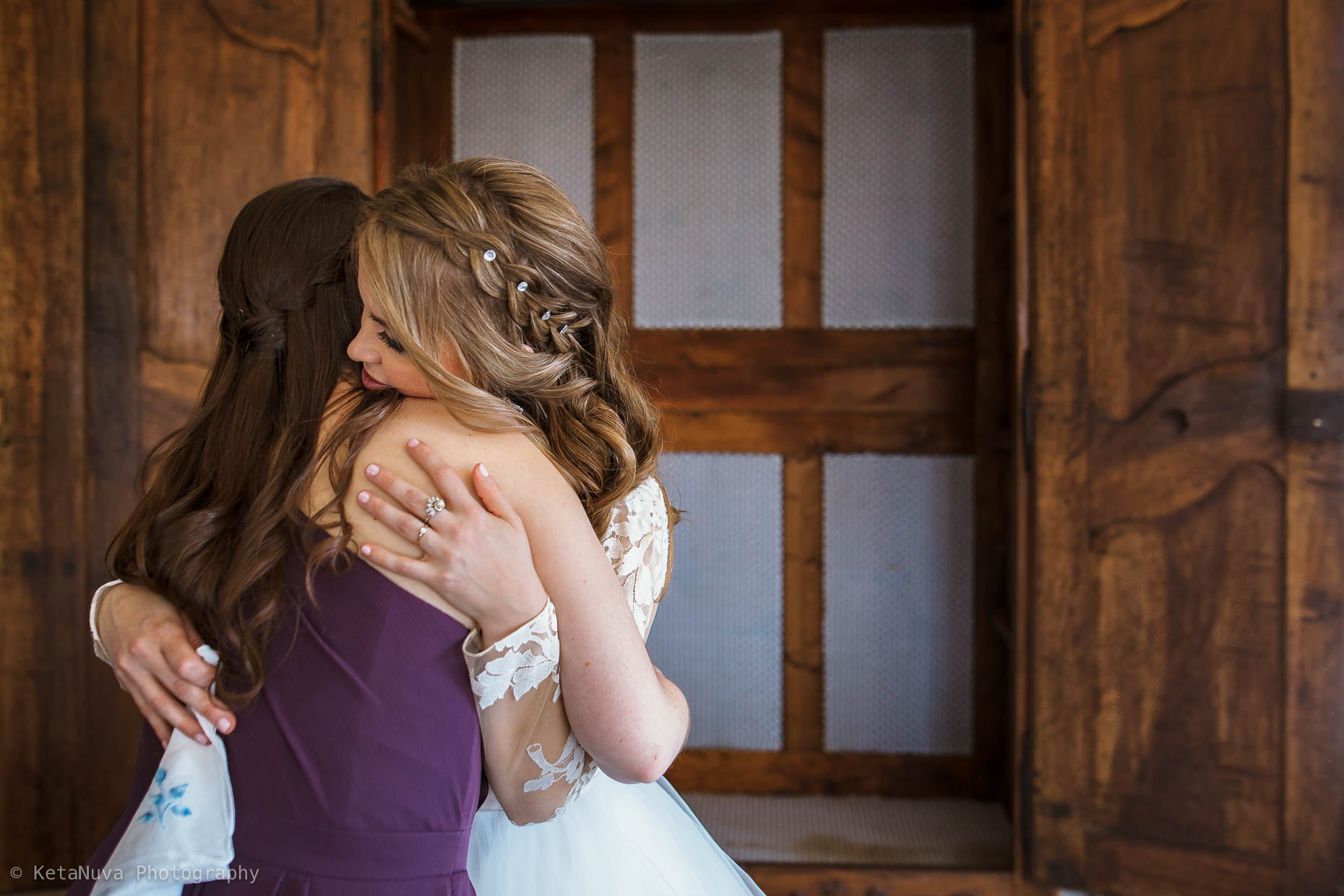 A candid moment shared with the bride and her maid of honor. 