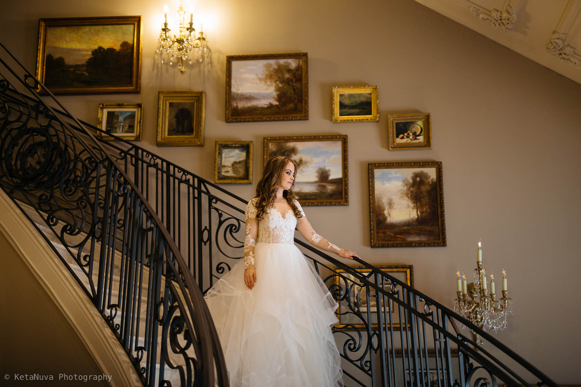 The first look- bride walking down the lovely stairs - Park Chateau Estate wedding 